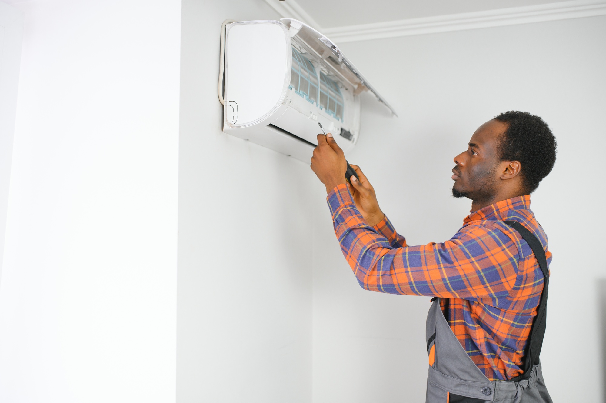 AC Electrician Technician Repairing Air Conditioner Appliance